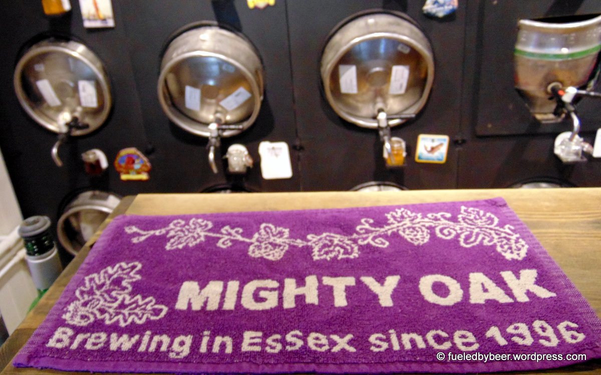 Mighty Oak Tap Room beer wall and bar towel